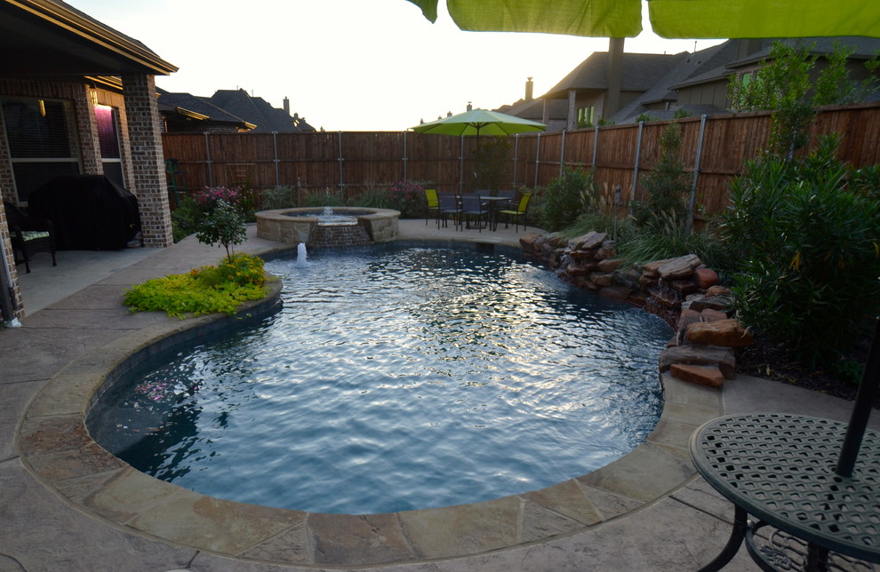 Inspiration for a small rustic backyard custom-shaped pool remodel in Dallas