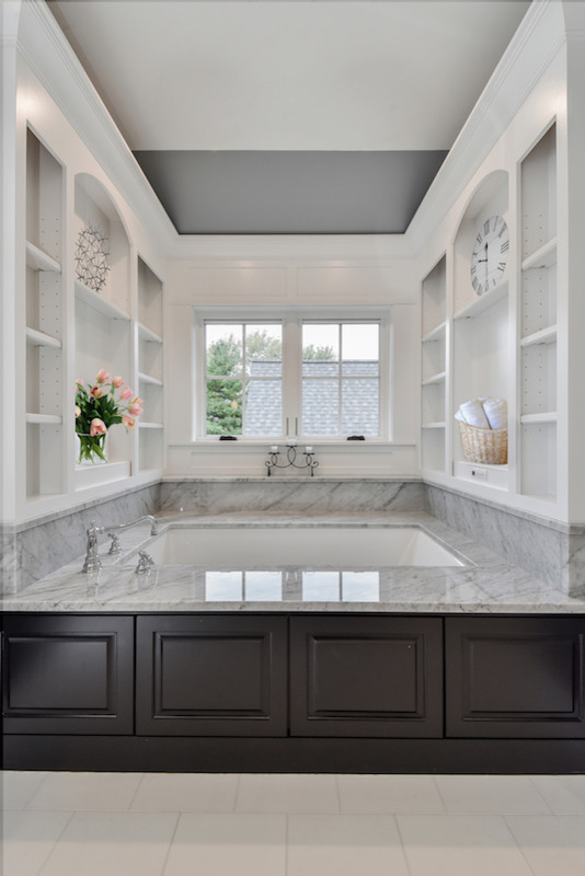 Inspiration for a large arts and crafts master bathroom in Chicago with dark wood cabinets, a hot tub, white tile, subway tile, grey walls, marble floors, an undermount sink and engineered quartz benchtops.