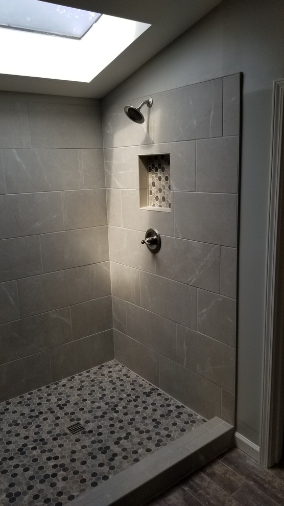 Photo of a modern bathroom in Atlanta with a corner shower, gray tile, slate, grey walls and an open shower.