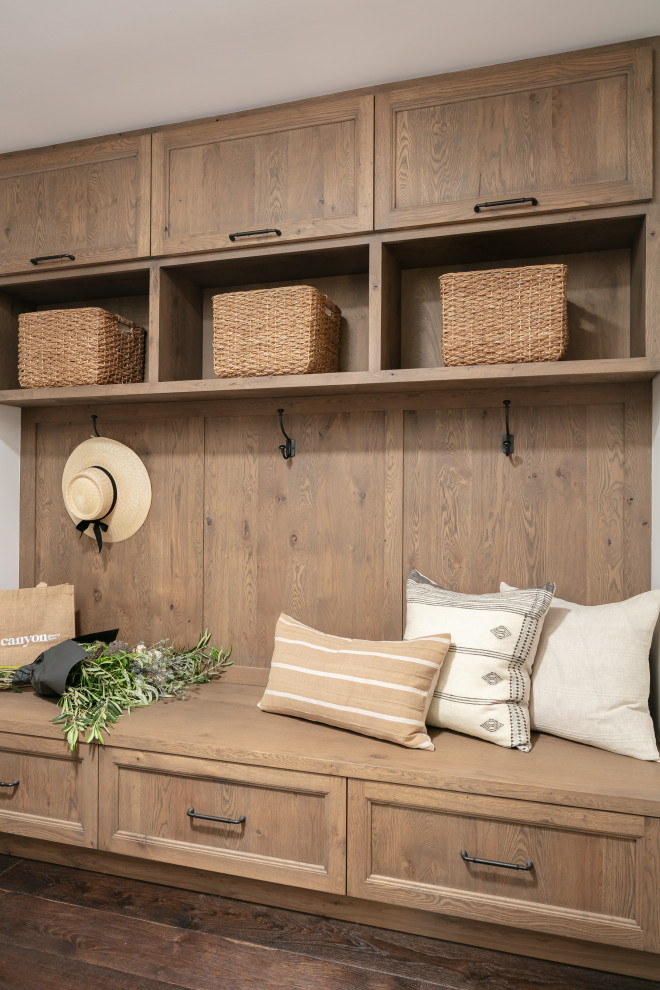 Inspiration for a mid-sized mediterranean dark wood floor mudroom remodel in Santa Barbara