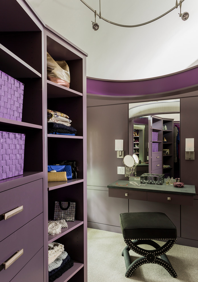 Large contemporary women's dressing room in Boston with carpet and beige floor.