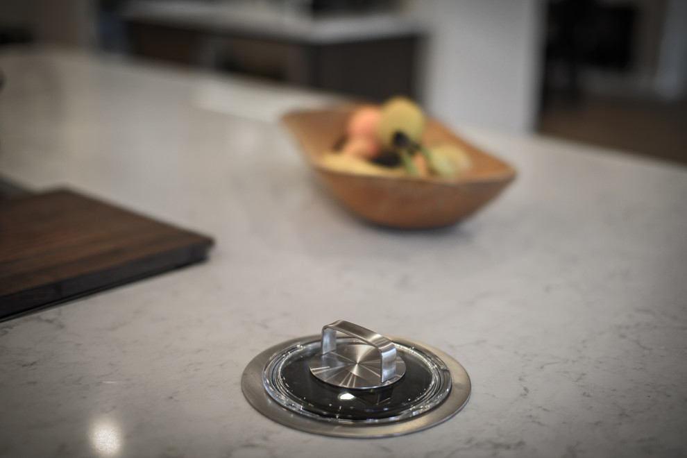 Inspiration for a large transitional galley light wood floor home design remodel in Jacksonville with a double-bowl sink, shaker cabinets, dark wood cabinets, quartz countertops, brown backsplash, ceramic backsplash, stainless steel appliances and two islands