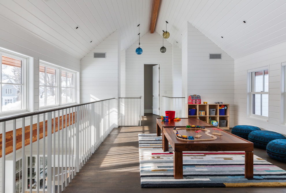 Inspiration for a large transitional gender-neutral kids' playroom for kids 4-10 years old in Minneapolis with white walls and dark hardwood floors.