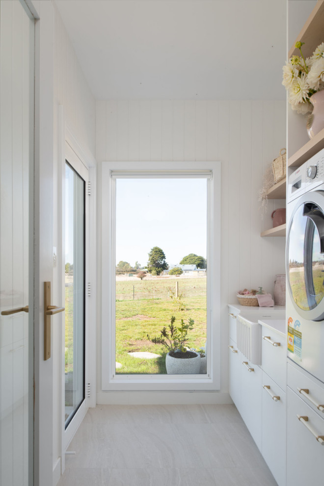 Photo of a beach style laundry room in Hobart.