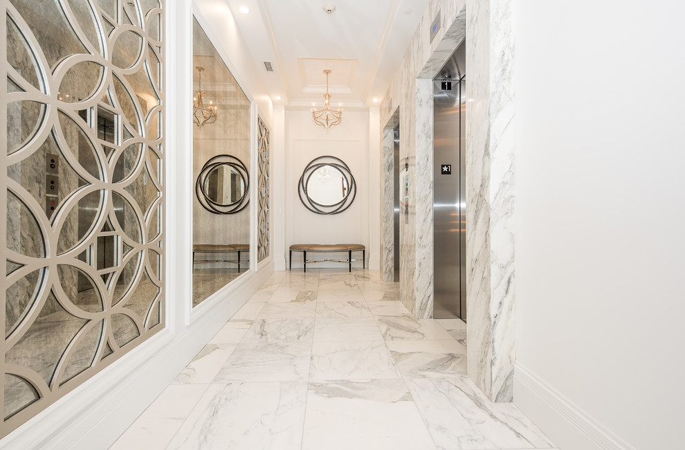 Transitional marble floor and white floor single front door photo with white walls and a dark wood front door