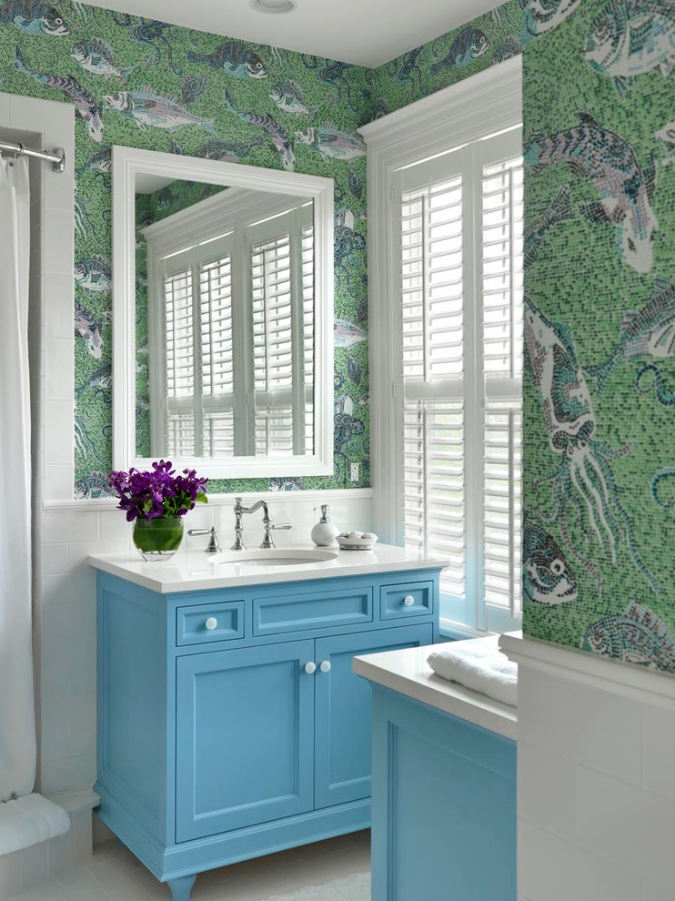 Mid-sized beach style 3/4 white tile and mosaic tile porcelain tile alcove shower photo in Boston with an undermount sink, recessed-panel cabinets, blue cabinets, quartz countertops, multicolored walls and white countertops