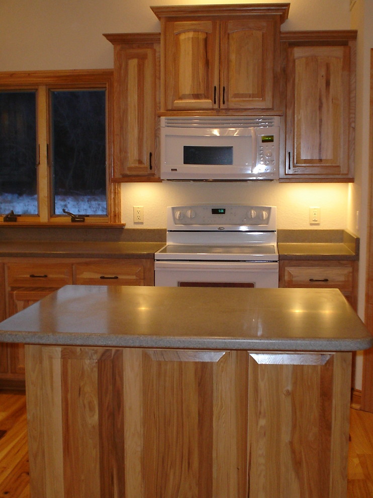 Inspiration for a kitchen remodel in Milwaukee with raised-panel cabinets and laminate countertops