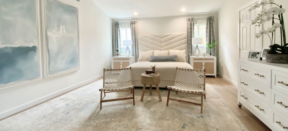 Design ideas for a medium sized coastal master bedroom in Miami with vinyl flooring.