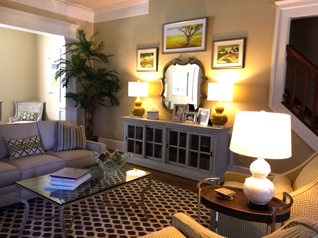 Mid-sized arts and crafts open concept living room in Raleigh with yellow walls, carpet and no fireplace.