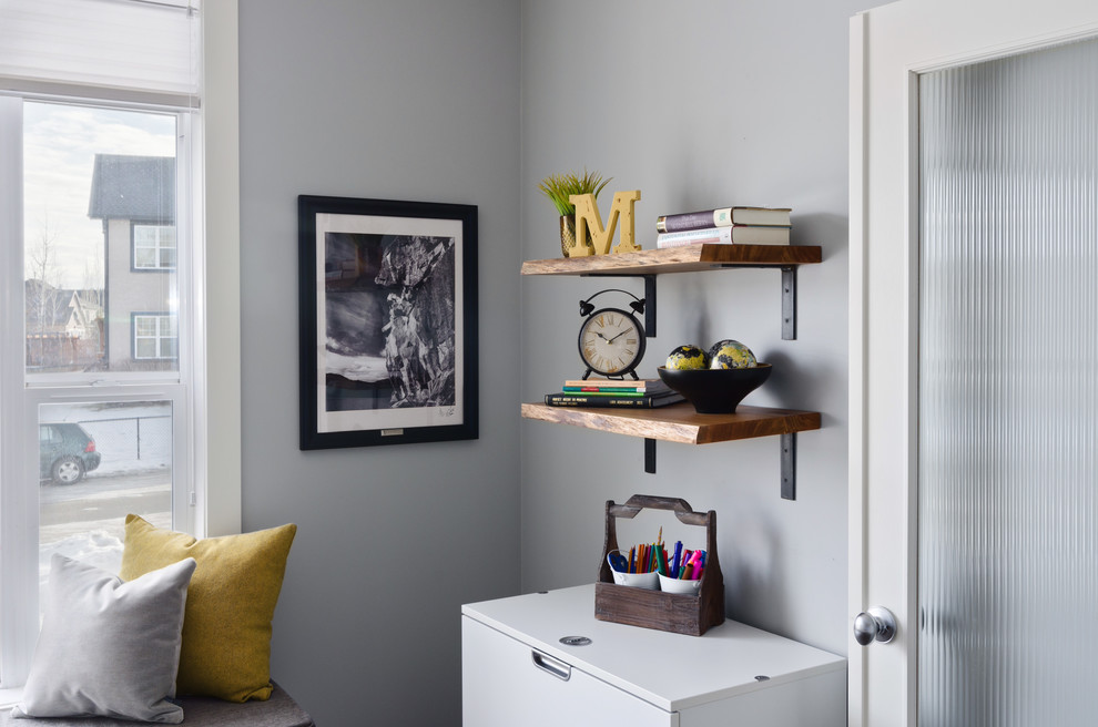 Design ideas for a transitional study room in Calgary with grey walls.