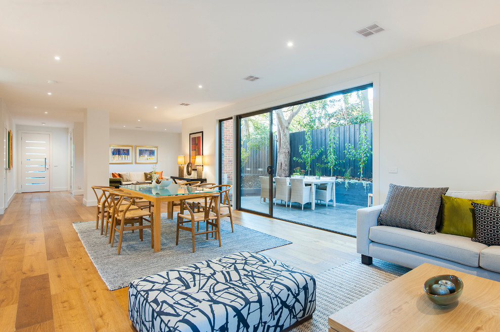 This is an example of a contemporary family room in Melbourne.