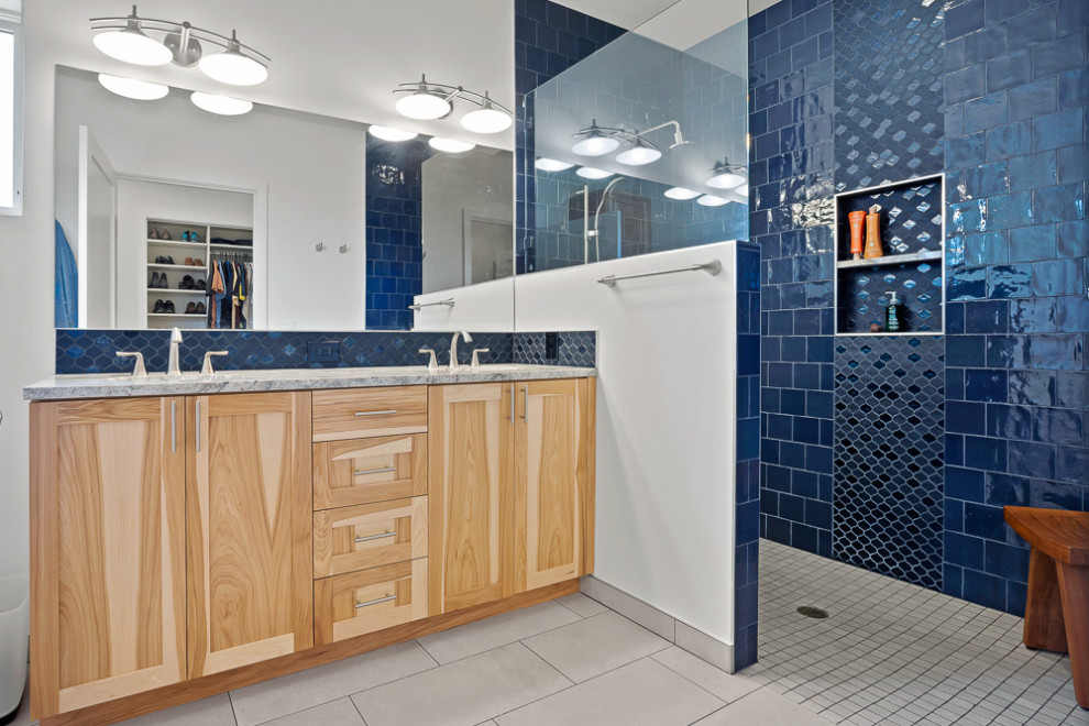Inspiration for a mid-sized transitional master black tile and ceramic tile porcelain tile, gray floor and double-sink bathroom remodel in Seattle with shaker cabinets, medium tone wood cabinets, an undermount sink, quartz countertops, gray countertops, a built-in vanity and a niche