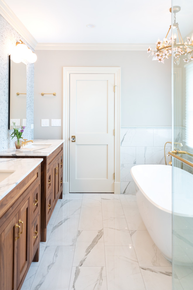 Luxury Bathroom Featuring Freestanding Bathtub and Wooden Vanity with Elegant Fi