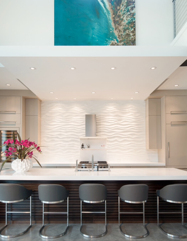 Mid-sized contemporary single-wall open plan kitchen in Miami with flat-panel cabinets, beige cabinets, stainless steel appliances and with island.