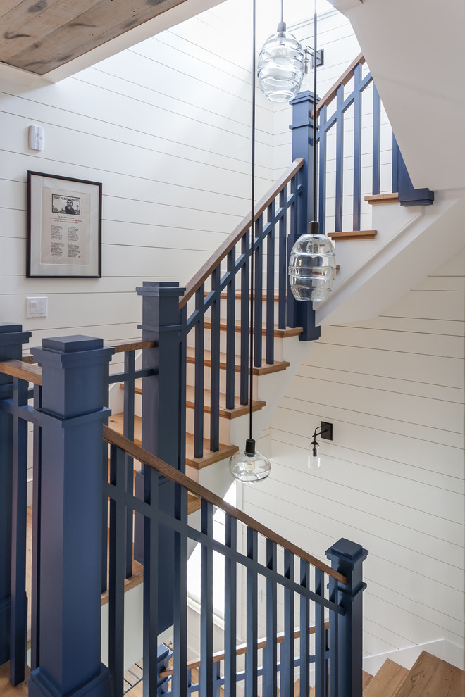 Inspiration for a small transitional wood straight staircase in New York with wood risers and wood railing.