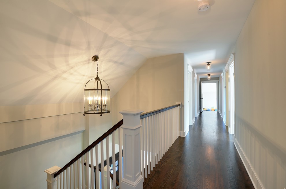 This is an example of a mid-sized traditional wood l-shaped staircase in Minneapolis.