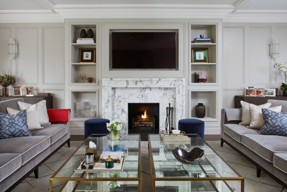 Design ideas for a transitional living room in Berkshire with grey walls, dark hardwood floors, a standard fireplace, a wall-mounted tv, brown floor and panelled walls.