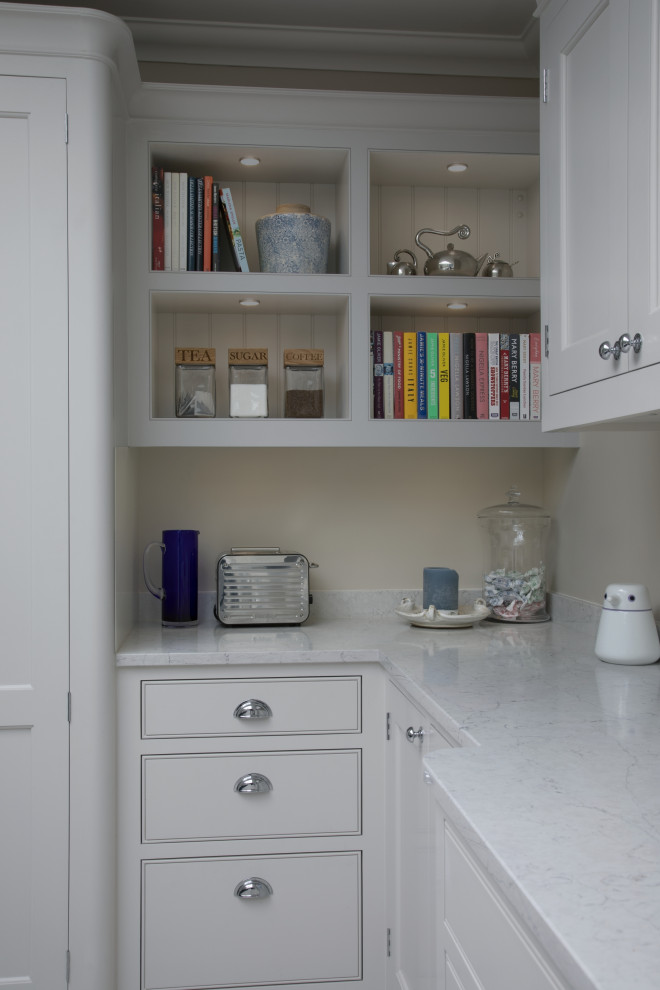 Design ideas for a medium sized classic l-shaped kitchen/diner in Surrey with a submerged sink, shaker cabinets, grey cabinets, quartz worktops, blue splashback, metro tiled splashback, stainless steel appliances, ceramic flooring, an island, grey floors and white worktops.