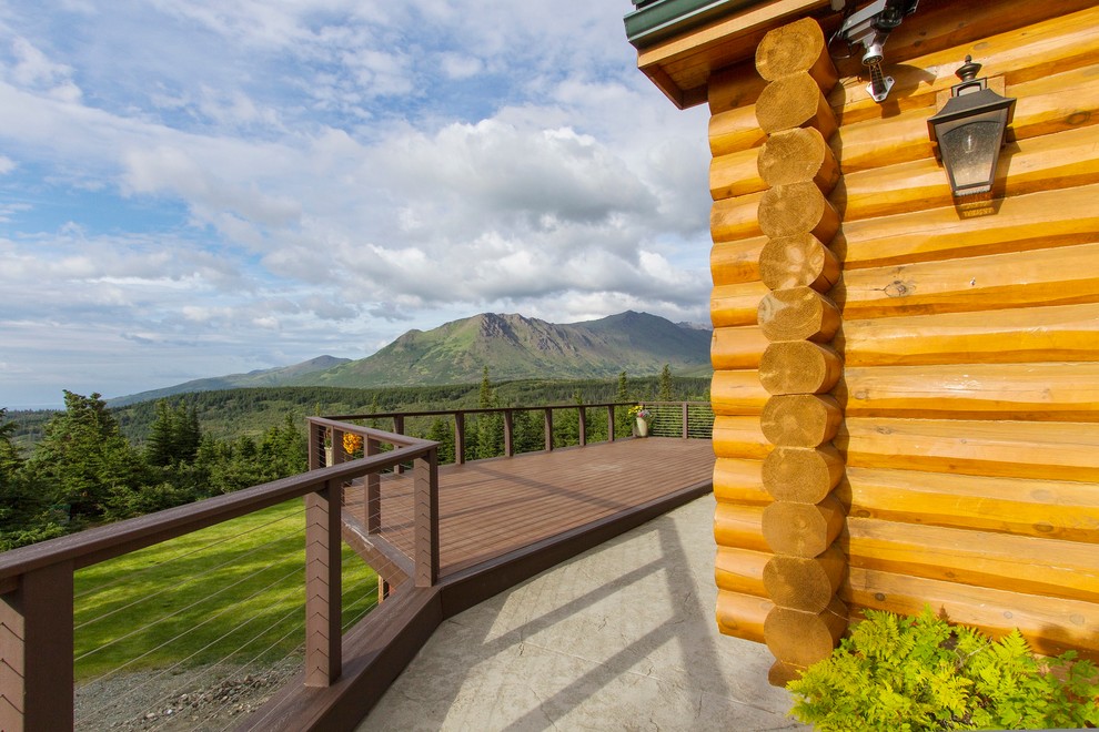 Mid-sized mountain style backyard deck photo with no cover