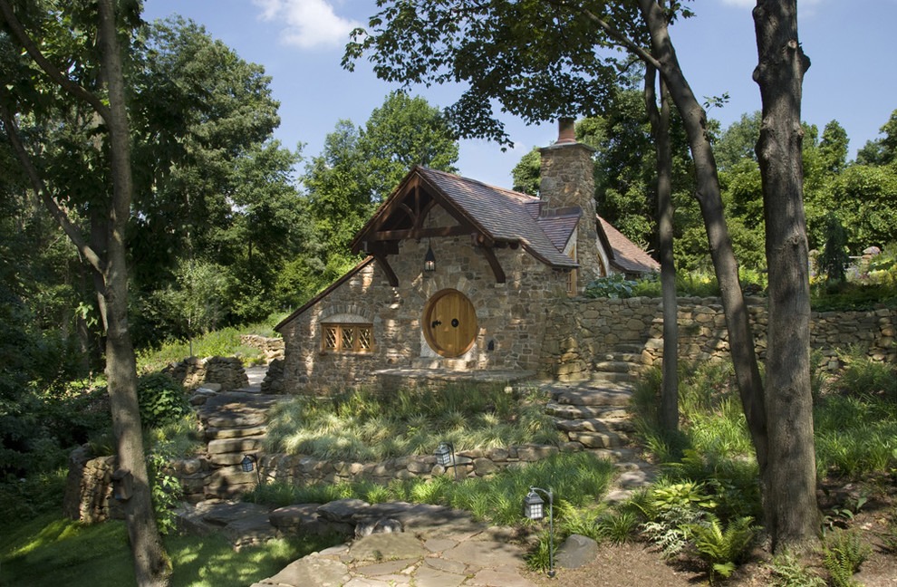 Design ideas for a country exterior in Philadelphia with stone veneer.