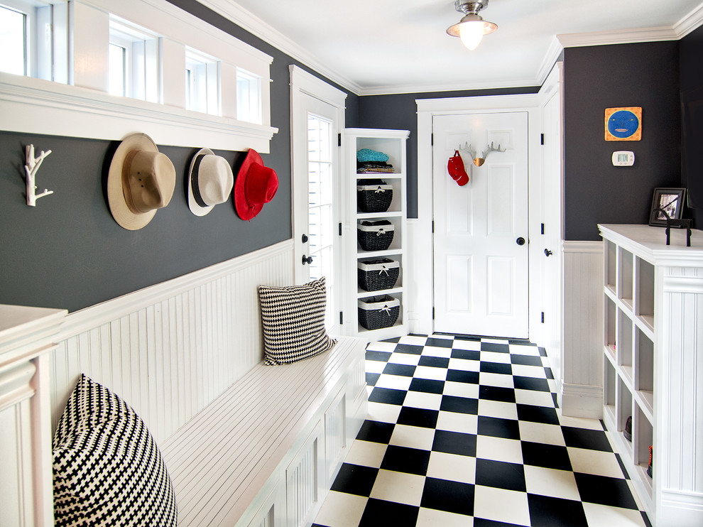 Inspiration for a traditional mudroom in Portland Maine with black walls.