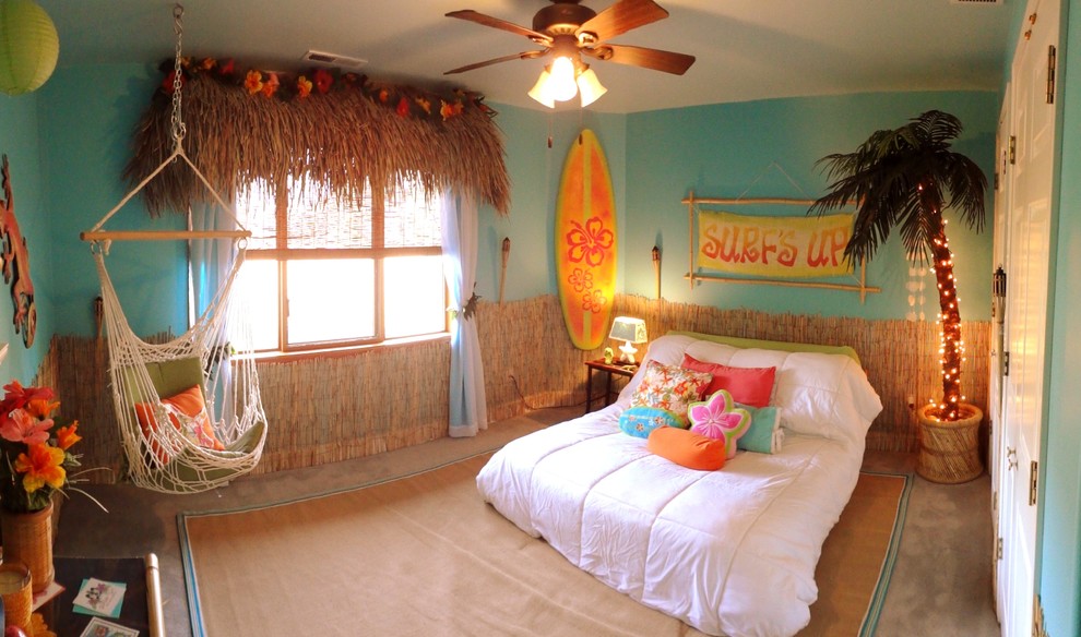 Inspiration for a tropical kids' room for girls in Seattle with carpet and blue walls.