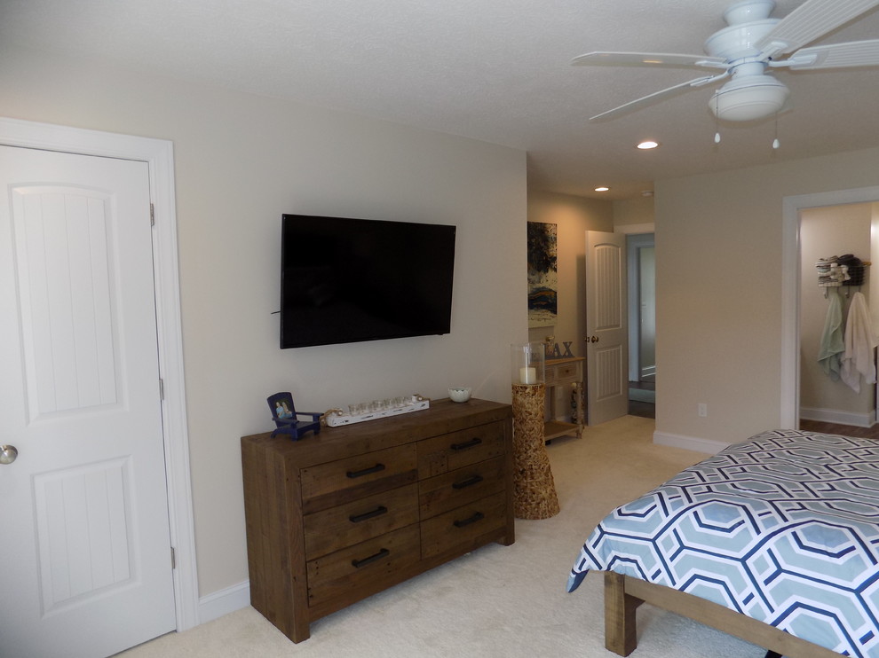 Design ideas for a mid-sized beach style master bedroom in Columbus with beige walls, carpet and white floor.