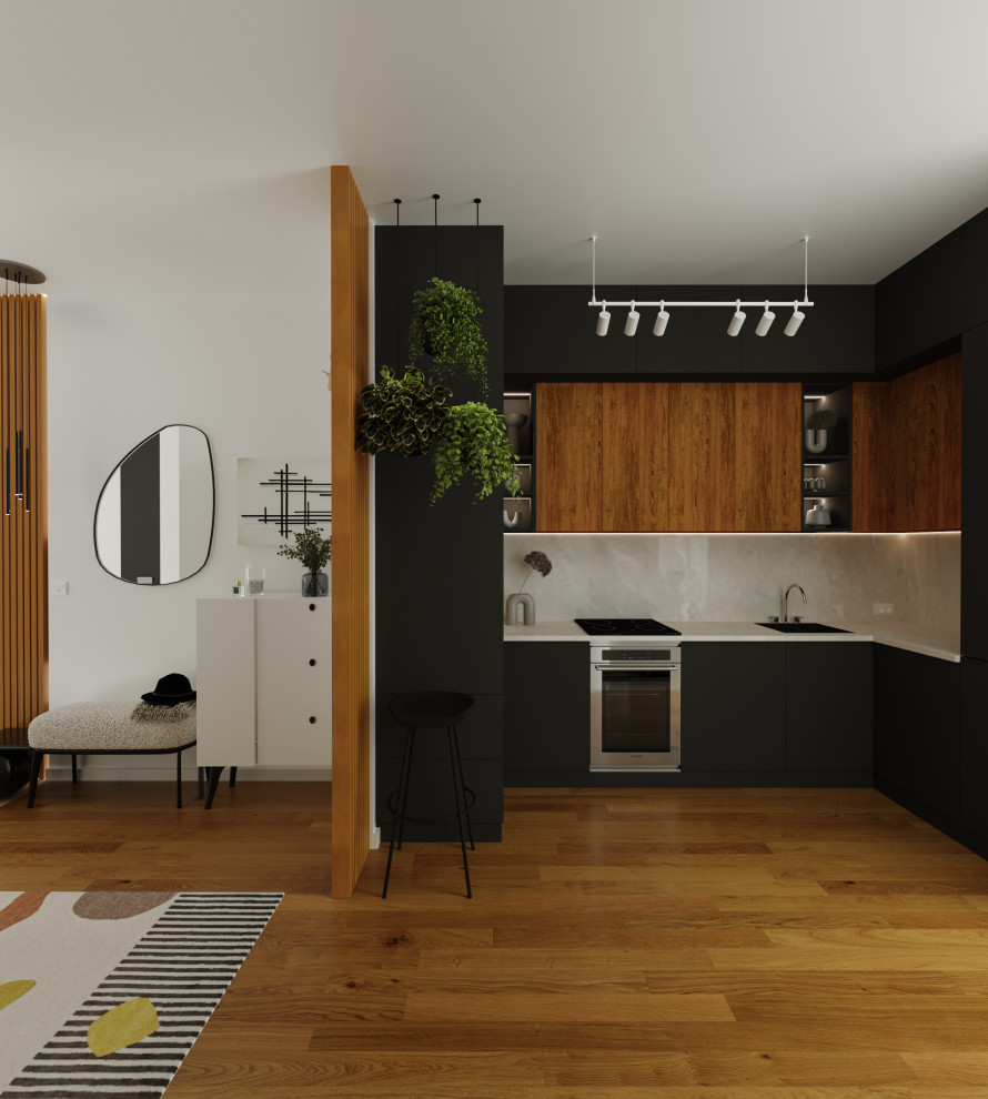 Cette image montre une cuisine ouverte design en U avec des portes de placard grises, plan de travail en marbre, une crédence beige, aucun îlot et un plan de travail beige.