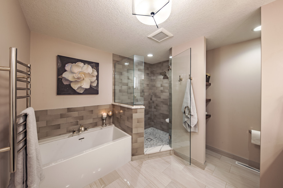 This is an example of a large transitional master bathroom in Minneapolis with recessed-panel cabinets, medium wood cabinets, beige walls, an undermount sink, a hinged shower door, beige benchtops, an enclosed toilet, a double vanity and a built-in vanity.