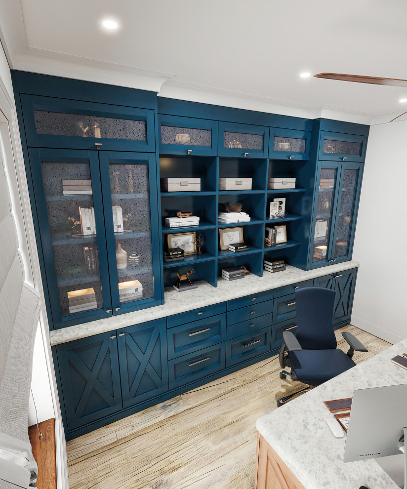 Inspiration for a mid-sized country freestanding desk light wood floor and beige floor study room remodel in Los Angeles with blue walls