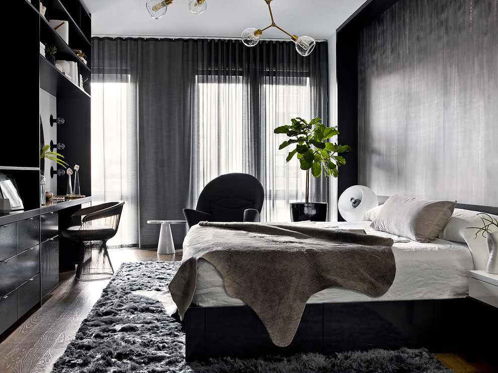 Contemporary master bedroom in Chicago with black walls, dark hardwood floors and no fireplace.