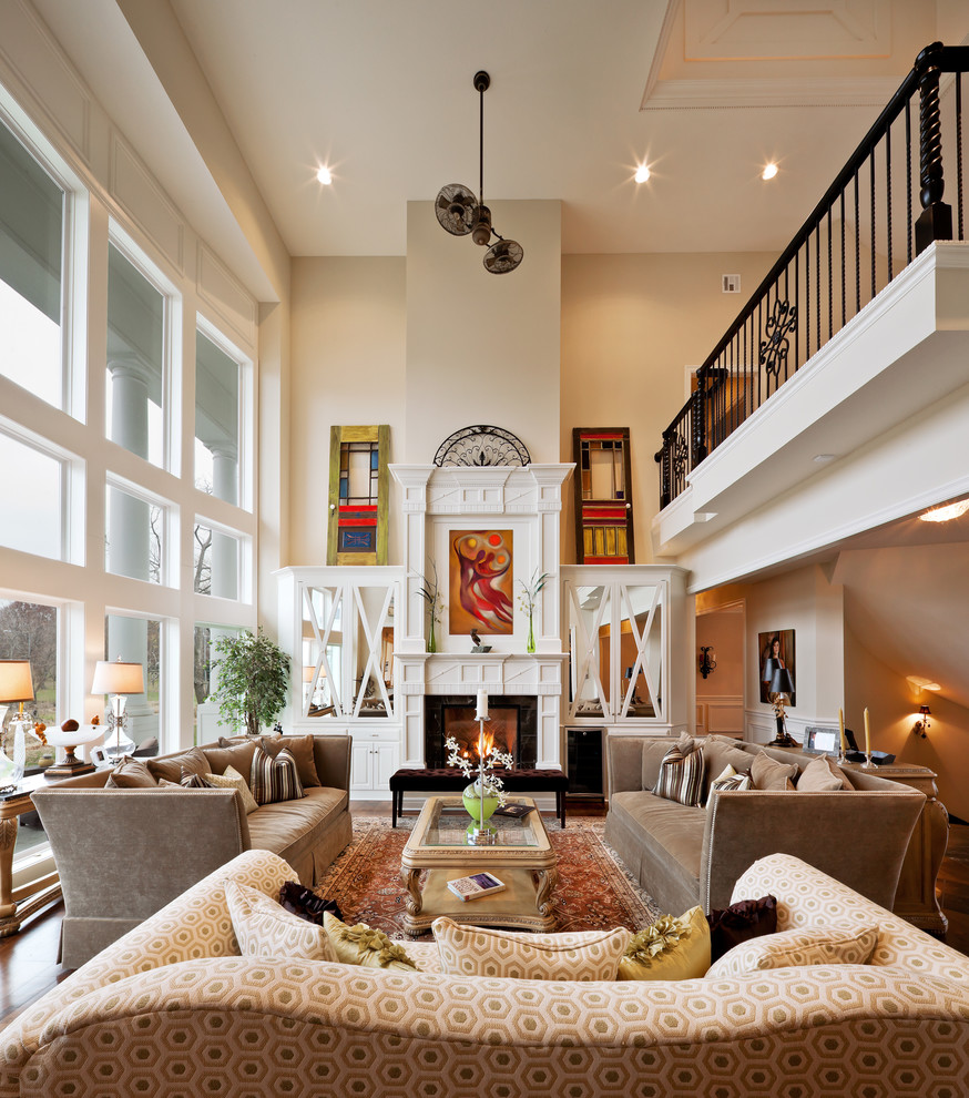 Traditional open concept living room in Kansas City with beige walls and a standard fireplace.