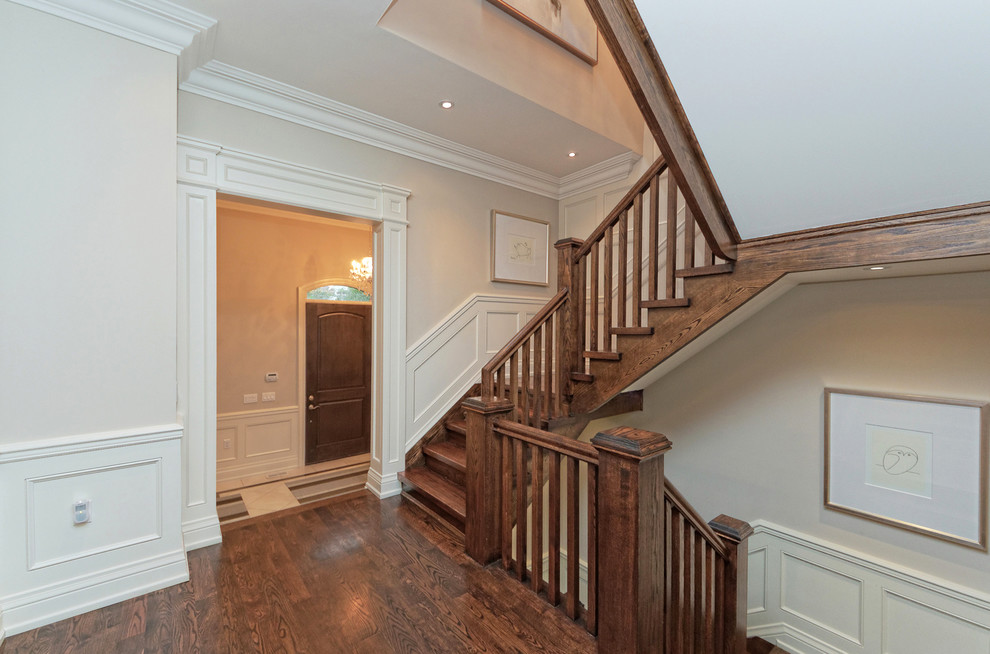 Mid-sized transitional wooden u-shaped wood railing staircase photo in Toronto with wooden risers