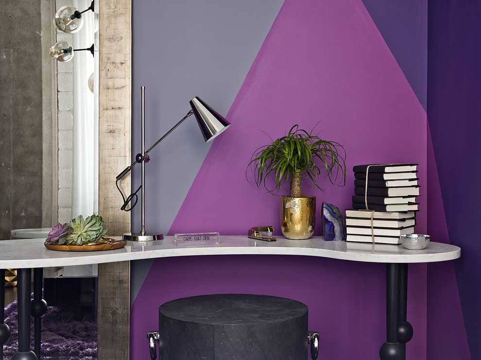 This is an example of a contemporary study room in Chicago with purple walls and a freestanding desk.
