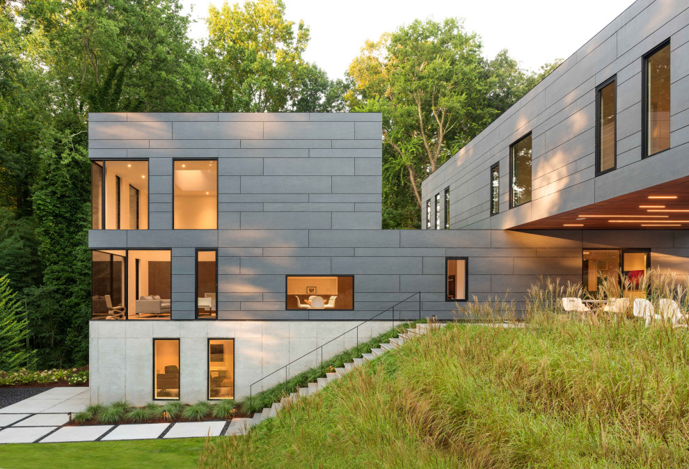 Contemporary gray three-story flat roof idea in Atlanta