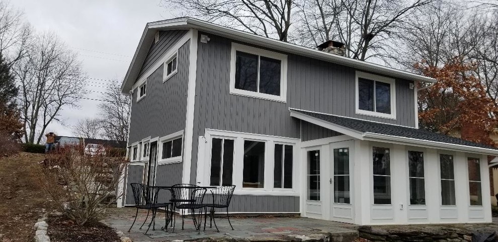 New siding freshens lake house; storm doors enclose porch and add living space