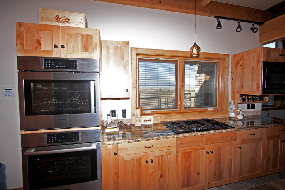 Eat-in kitchen - large rustic u-shaped eat-in kitchen idea with medium tone wood cabinets, an island and shaker cabinets