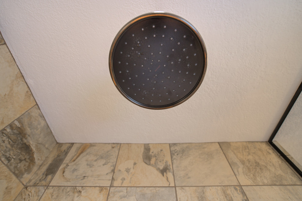Home design - mid-sized transitional master multicolored tile ceramic tile home design idea with raised-panel cabinets, beige cabinets, a two-piece toilet, beige walls, an undermount sink and quartz countertops