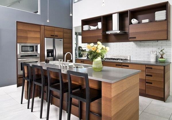 Photo of a large country eat-in kitchen in Los Angeles with a double-bowl sink, dark wood cabinets, zinc benchtops, white splashback, stainless steel appliances, porcelain floors, with island and glass tile splashback.