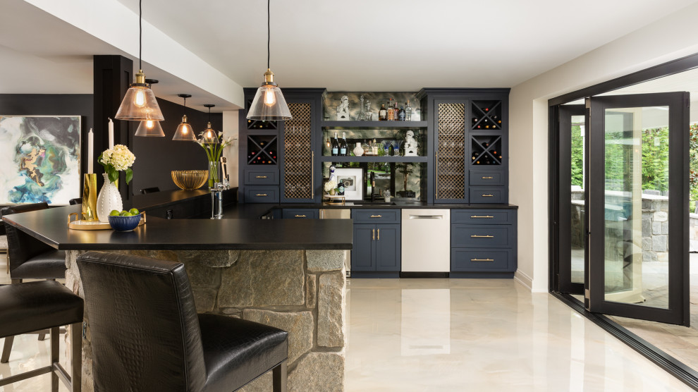 This is an example of a large contemporary walk-out basement in DC Metro with a home bar, black walls, concrete flooring, a standard fireplace, a stone fireplace surround and white floors.