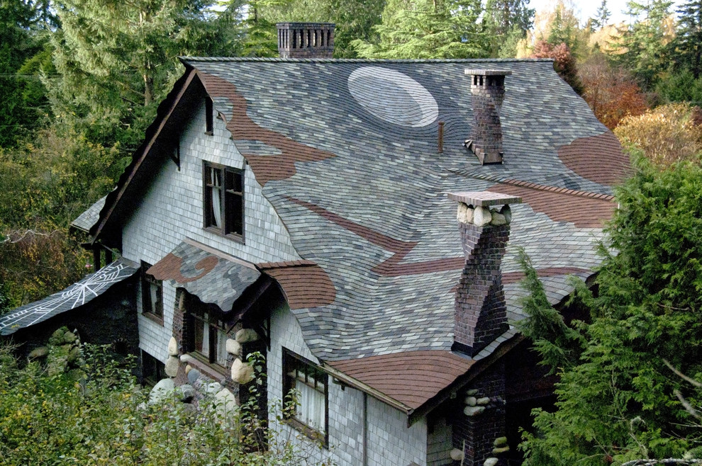 Eclectic gray wood exterior home idea in Seattle