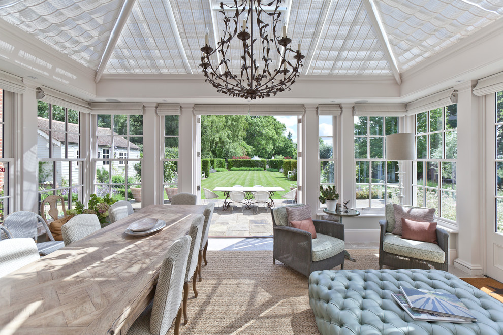 Photo of a mid-sized traditional sunroom in Other with a glass ceiling and beige floor.