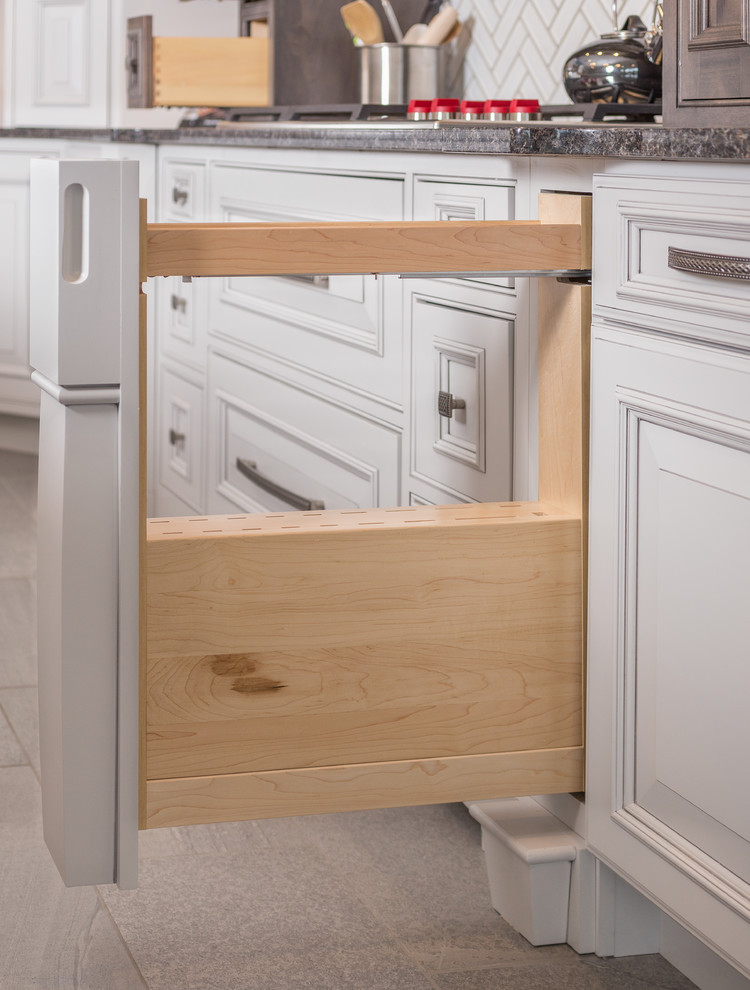 Inspiration for a large transitional l-shaped gray floor open concept kitchen remodel with shaker cabinets, medium tone wood cabinets, granite countertops, white backsplash, subway tile backsplash, stainless steel appliances and an island
