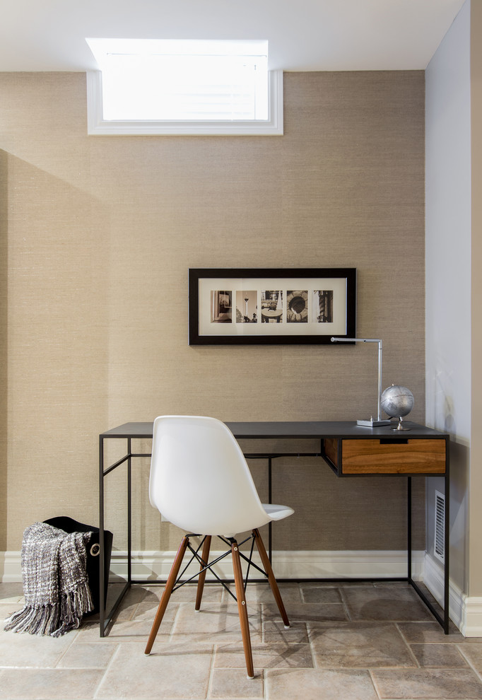 Contemporary home office in Toronto with beige walls and a freestanding desk.