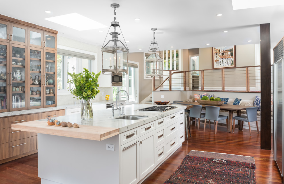 Transitional eat-in kitchen in San Francisco with an undermount sink, shaker cabinets, white cabinets, medium hardwood floors and with island.