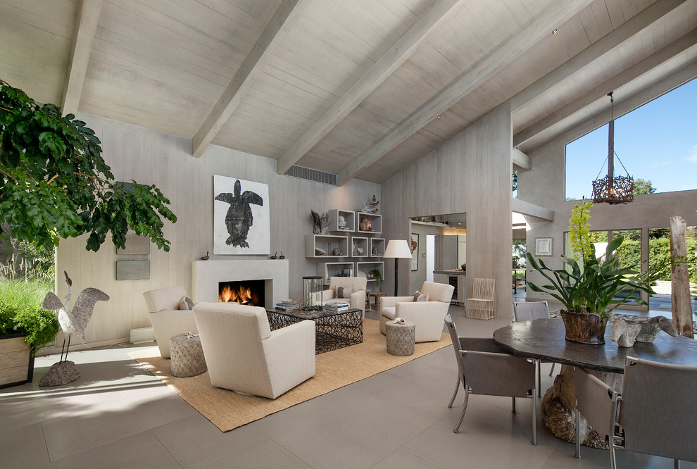 Inspiration for a mid-sized contemporary formal open concept living room in Santa Barbara with grey walls, a standard fireplace, porcelain floors, a stone fireplace surround and no tv.