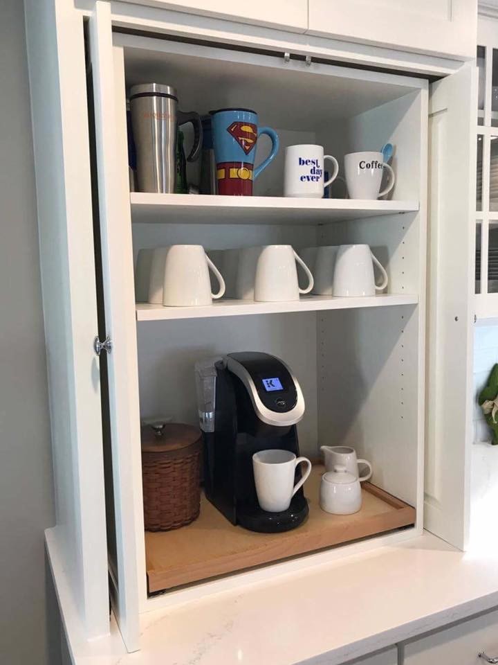 Example of a transitional l-shaped kitchen design in Philadelphia with a farmhouse sink, shaker cabinets, white cabinets, marble countertops, white backsplash, subway tile backsplash, stainless steel appliances and an island