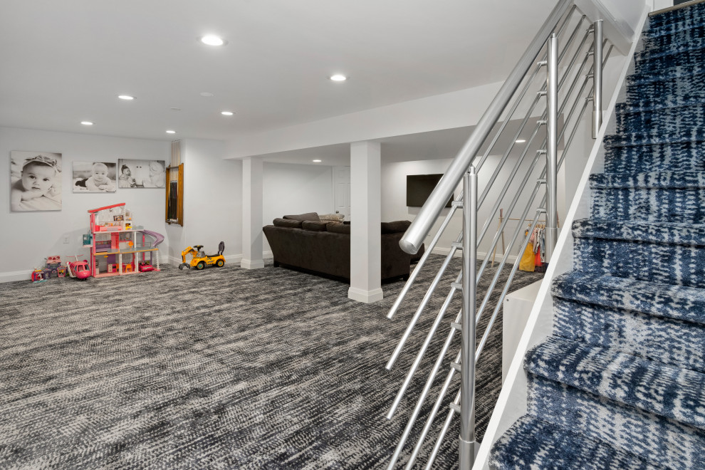 Inspiration for a large timeless underground carpeted and gray floor basement remodel in Philadelphia with gray walls and no fireplace