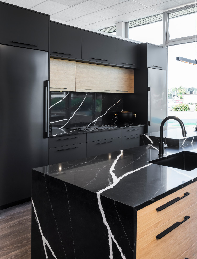 Design ideas for an eat-in kitchen in Other with an undermount sink, flat-panel cabinets, black cabinets, quartz benchtops, black splashback, engineered quartz splashback, black appliances, with island and black benchtop.