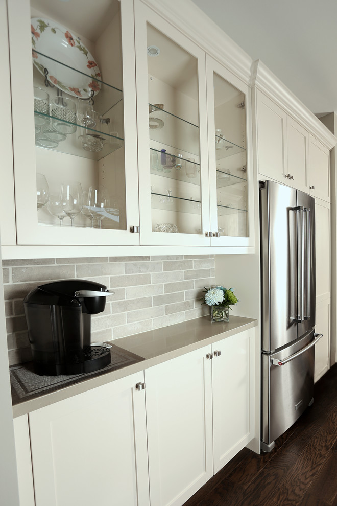 Inspiration for a mid-sized transitional galley dark wood floor and brown floor open concept kitchen remodel with an undermount sink, shaker cabinets, beige cabinets, quartz countertops, beige backsplash, porcelain backsplash, stainless steel appliances and no island